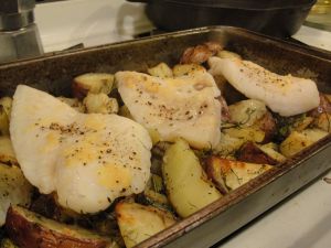 Pangasius fillets baked atop roasted fennel and potatoes