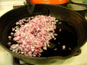 Sautéing the onion in olive oil.