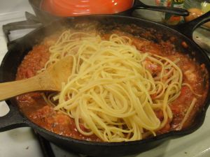 Add the al dente pasta.