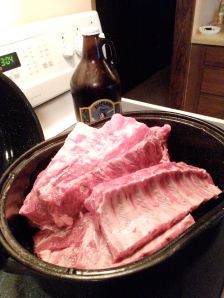 Preparing the ribs for pre-cooking, with a pint or two from a growler of scotch ale.
