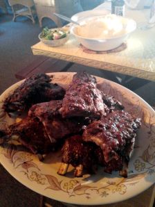 A family dinner with BBQ ribs.