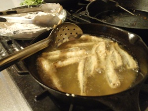 Fry the coated smelts in oil (at ~320° F).