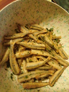 Toss the fried smelts with cilantro and garlic, sautéed in olive oil.