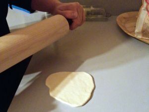 Rolling out dough for steamed bao.