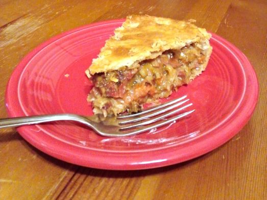 A slice of corned beef and cabbage pie.